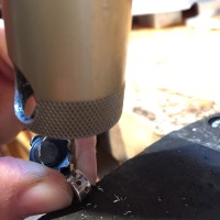 drilling the settings for the diamonds in the bail